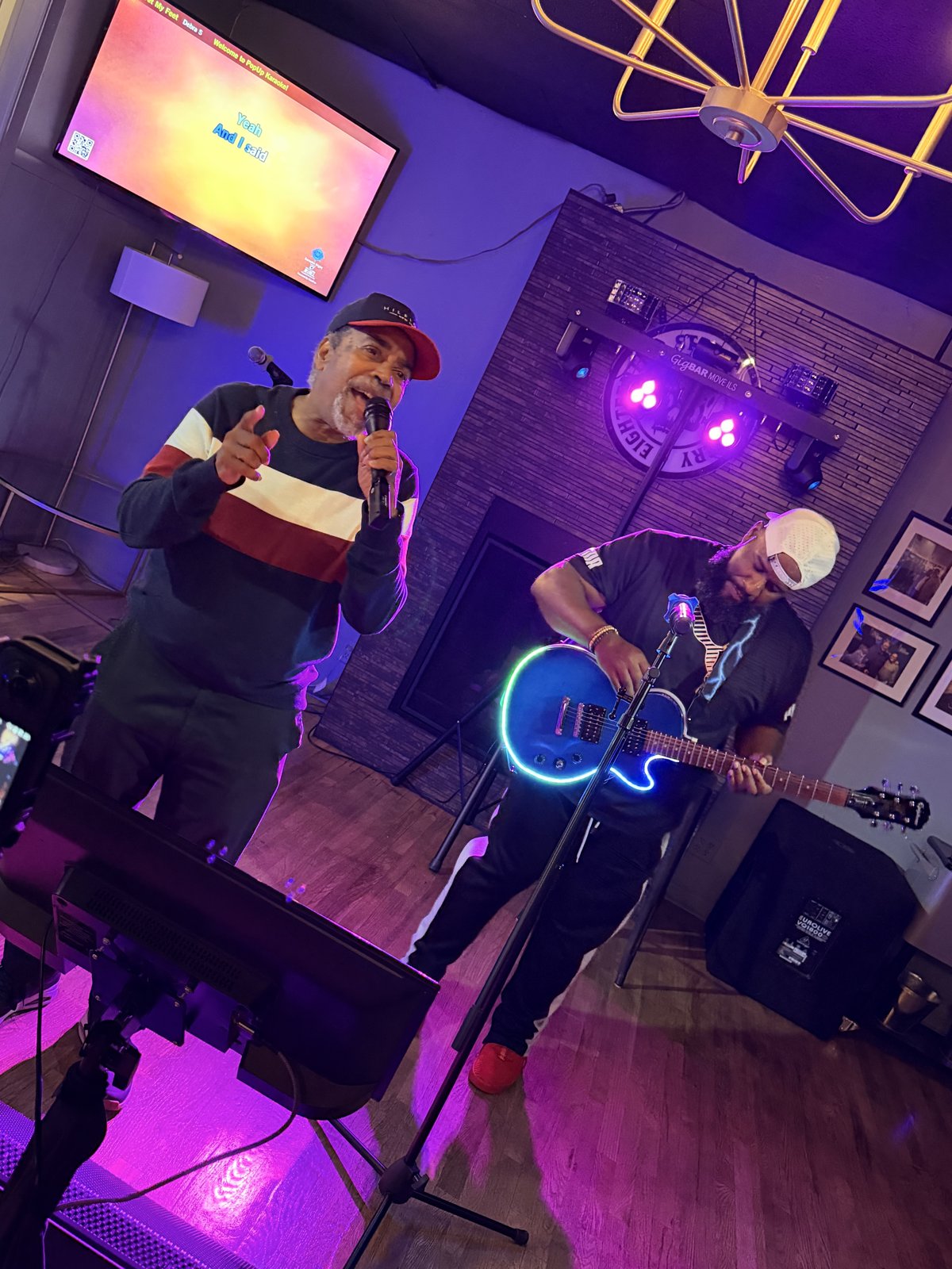 Singer performing with live guitarist at 18th Street Brewery karaoke night Gary Indiana June 2026