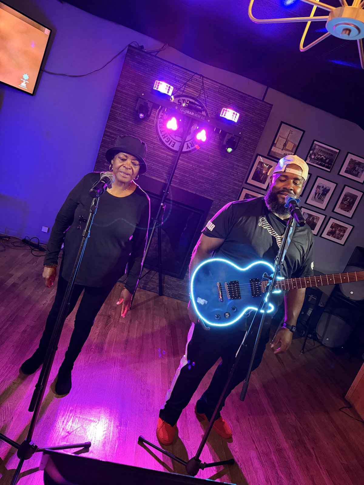 Vocalist and guitarist performing together at 18th Street Brewery karaoke Gary Indiana June 2026